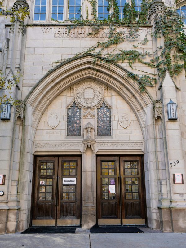 pexels-photo-10121596-10121596 Gothic stone facade of university entrance with intricate designs and ivy in Chicago.